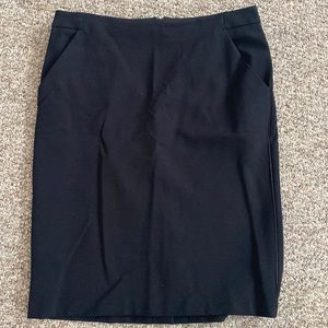 Size 12 casual business skirt slim fit with front pockets.